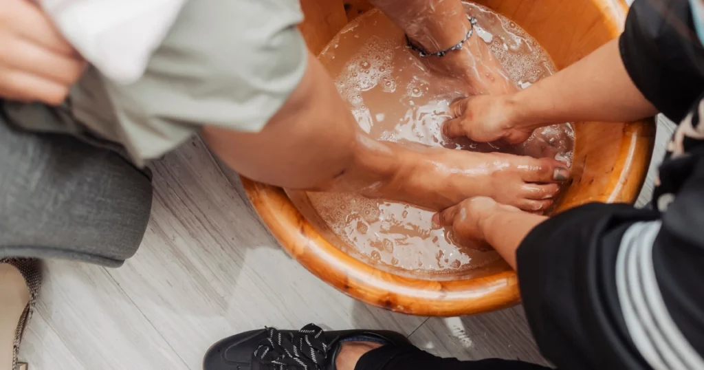 Foot Detox spa treatment with feet soaking in wooden bowl, Broomfield, CO